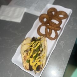 Mel's Place - MY hot sausage and onion rings were bomb. The lumpia too.