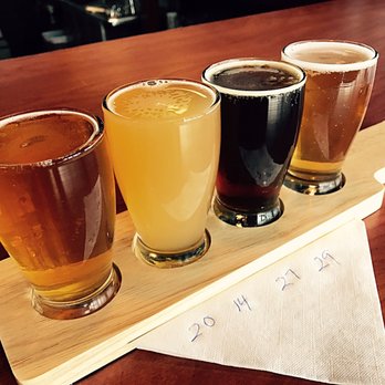 The Corner Craft Beer - From L to R: Guadalupe IPA, Austin EastCiders Pineapple, BS Brewing College Chronic Red Ale, BS Brewing Caedmon's Ale. - Beer Bar Near Me - San Antonio, Texas