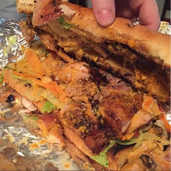 The Great BBQ - a person holding a sandwich - Food Trucks Near Me - Roanoke, Virginia