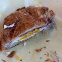 Bacon egg and cheese croissant with onion. $7.90 after tax and card fee