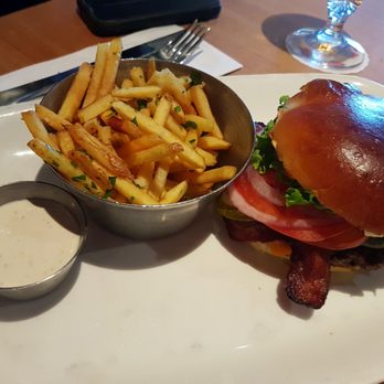 Earls Kitchen + Bar - Bacon Cheddar Burger Cured bacon, tomatoes, onion, lettuce, pickles, mayonnaise and mustard, on a freshly baked brioche bun - Canadian (New) Near Me - Edmonton, Alberta Earls Kitchen + Bar - Bacon Cheddar Burger Cured bacon, tomatoes, onion, lettuce, pickles, mayonnaise and mustard, on a freshly baked brioche bun - Canadian (New) Near Me - Edmonton, Alberta