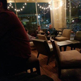 Lush Fine Wines & Specialty - a man sitting in a lounge area - Beer, Wine & Spirits Near Me - Hanford, California