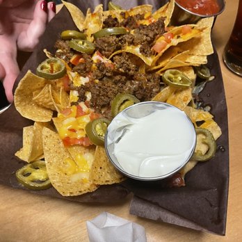 Firkin On Danforth - a plate of nachos with sauce - Pubs Near Me - Toronto, Ontario