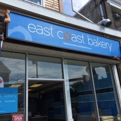 East Coast Bakery - Workers from Pulse Signs installing our new sign. It looks beautiful!