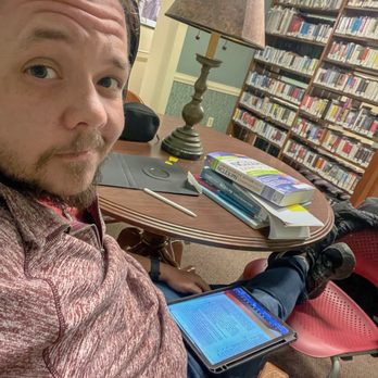 Cresent Hill Library - Small table tucked between the stacks downstairs. Perfect for a little study sesh. - Libraries Near Me - Louisville, Kentucky