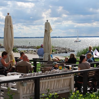 Cafe Knatter - Restaurantterrasse mit Blick aufs Achterwasser - Cafes Near Me - Ückeritz, MV Cafe Knatter - Restaurantterrasse mit Blick aufs Achterwasser - Cafes Near Me - Ückeritz, MV