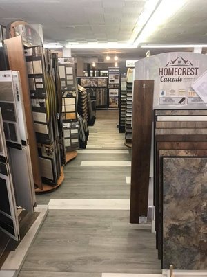 Showroom - Embark on a journey to find the perfect flooring solution for your project, whether it’s the warmth of hardwood, the softness of carpet, the versatility of luxury vinyl, the durability of laminate, or the elegance of tile. Rely on our experts to help you make a choice that reflects your style and budget.