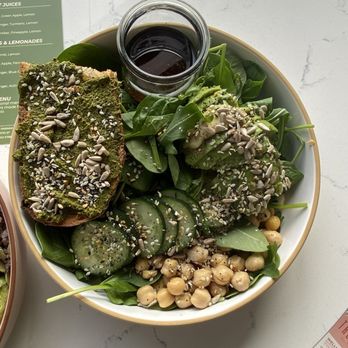 The Grove Juicery - Power lunch greens bowl, avocado, chickpea, cucumber, microgreens, sunflower seeds, sesame seeds, House vinaigrette & pesto toast. - Juice Bars & Smoothies Near Me - Omaha, Nebraska The Grove Juicery - Power lunch greens bowl, avocado, chickpea, cucumber, microgreens, sunflower seeds, sesame seeds, House vinaigrette & pesto toast. - Juice Bars & Smoothies Near Me - Omaha, Nebraska