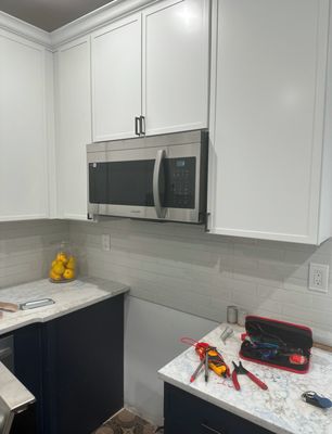 Microwave Repair - Service Repair and Maintenance on Microwave built in the kitchen cabinets