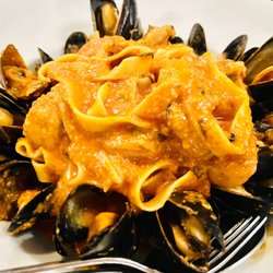 Elite Steak & Seafood - Seafood pasta in a rose sauce.  The mussels were super fresh with generous pieces of scallop and shrimp.
