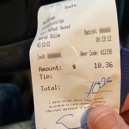 a hand holding a receipt a hand holding a receipt