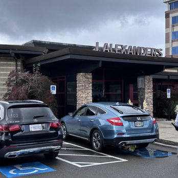 J. Alexander's - Dodging raindrops going in! - Steakhouses Near Me - Cincinnati, Ohio