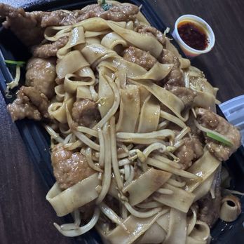 Happy Garden - Beef chow Fun-  delicious. Asked for chili oil in side. And tender bites of beef - Chinese Near Me - Augusta, Georgia