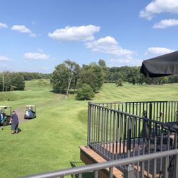 Black Dog Tavern - View of golf course from patio and tables.