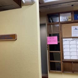 Cabrillo Fitness - Women's Locker room, pink sign that does not state MALE worker inside