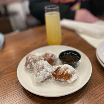 Another Broken Egg Cafe - a plate of doughnuts and a glass of orange juice - Breakfast & Brunch Near Me - Pembroke Pines, Florida Another Broken Egg Cafe - a plate of doughnuts and a glass of orange juice - Breakfast & Brunch Near Me - Pembroke Pines, Florida