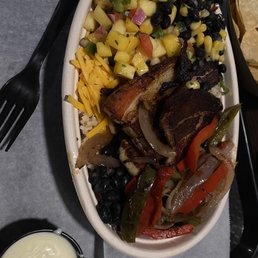 Rice bowl with pork belly added on everything but guacamole and sour cream Rice bowl with pork belly added on everything but guacamole and sour cream