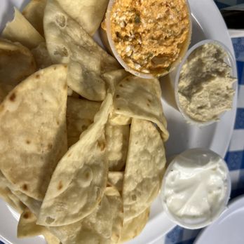 The Parthenon Greek-American Eats - Mediterranean Trio: (clockwise L to R) Pita chips, Feisty Feta, Hummus & Tzatziki - Greek Near Me - Danville, Kentucky The Parthenon Greek-American Eats - Mediterranean Trio: (clockwise L to R) Pita chips, Feisty Feta, Hummus & Tzatziki - Greek Near Me - Danville, Kentucky