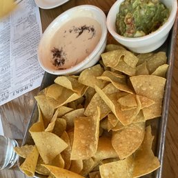 Brisket queso with guacamole nachos