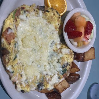 Blue Dolphin Cafe - Seafood frittata w crispy potatoes and fresh fruit - Breakfast & Brunch Near Me - Sarasota, Florida Blue Dolphin Cafe - Seafood frittata w crispy potatoes and fresh fruit - Breakfast & Brunch Near Me - Sarasota, Florida