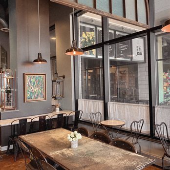 Eggshell Bistro - a dining area with tables and chairs - Coffee & Tea Near Me - Carmel, Indiana