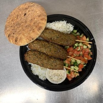 Siena's - a plate of meat skewers and rice - Pizza Near Me - Rockville, Maryland