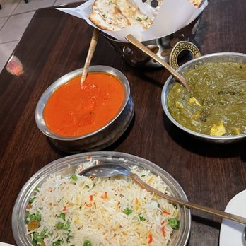Indian Haweli - Pilau rice(w/nuts & raisins), Chicken Tikka Masala, Saag Paneer, Galic Naan. All were delicious! - Indian Near Me - Simi Valley, California