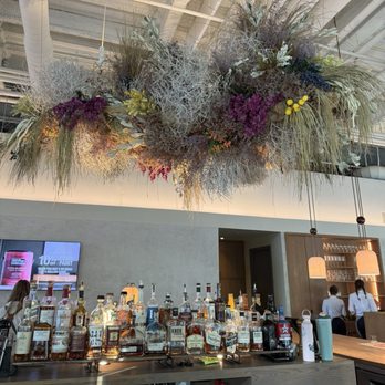 Solstice - Pretty florals above the bar - New American Near Me - Irvine, California