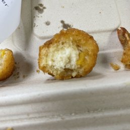 Corn fritter over cooked and grease soaked.