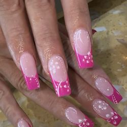 Vi Nails - 5. "A colorful twist on a timeless favorite."  Brighten up the classic French tip with a pop of neon pink! Fun, modern, and guaranteed to t