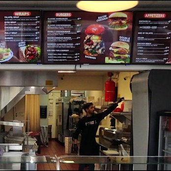 Falafel Corner - The menu is posted above the counter, as Mohammed begins working on my order. - Greek Near Me - Roseville, California Falafel Corner - The menu is posted above the counter, as Mohammed begins working on my order. - Greek Near Me - Roseville, California