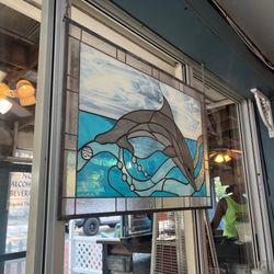 Molly Goodhead's Raw Bar & Restaurant - Stained glass dolphin