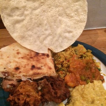 Moonlight Cuisine - The takeaway deliciousness plated with a poppadom. - Indian Near Me - Birmingham, XWM