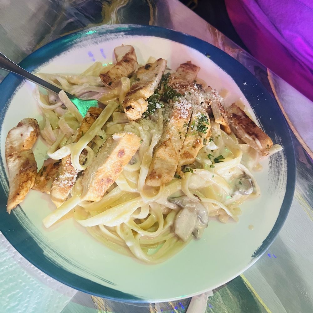 Mushroom Fettuccine Alfredo with added Grilled Chicken. The sauce was creamy as it should be!. Mushroom Fettuccine Alfredo with added Grilled Chicken. The sauce was creamy as it should be!.