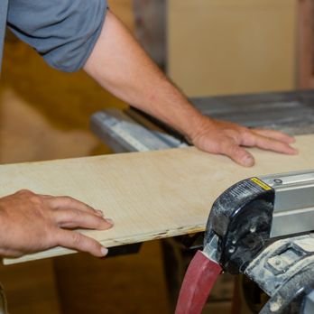 RLS Construction Remodel Design - a man working on a table saw - General Contractors Near Me