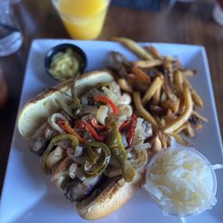 The Vanguard Brewpub & Distillery - Beer Brauts  with spicy mustard and sauerkraut. Hand-Cut French Fries