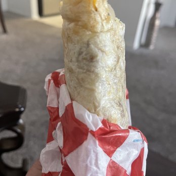 Bravo Burgers - a hand holding a burrito wrapped in red and white checkered paper - Burgers Near Me - Redlands, California