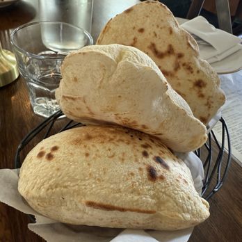 Ammatoli - Three pieces of pizza for six dollars. We got two orders it was so delicious but again I feel I should come with the mezza plate. - Mediterranean Near Me - Long Beach, California