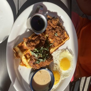 Tupelo Honey Southern Kitchen & Bar - Chicken and  Country Style Fried Chicken & Waffles. This  was the star of the table although the over medium were more like easy. Delicious - Southern Near Me - Myrtle Beach, South Carolina