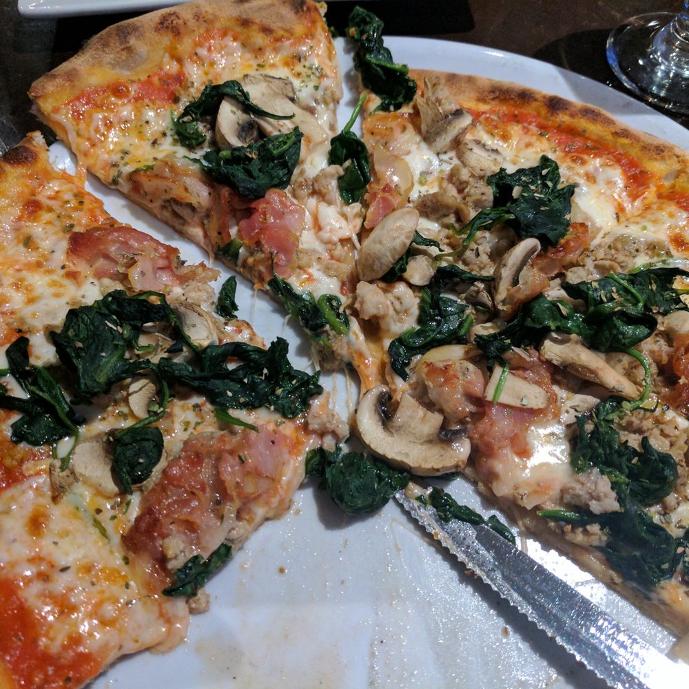 Pizza Capriciossa with spinach added. Made the crust a little "watery" but added great flavor