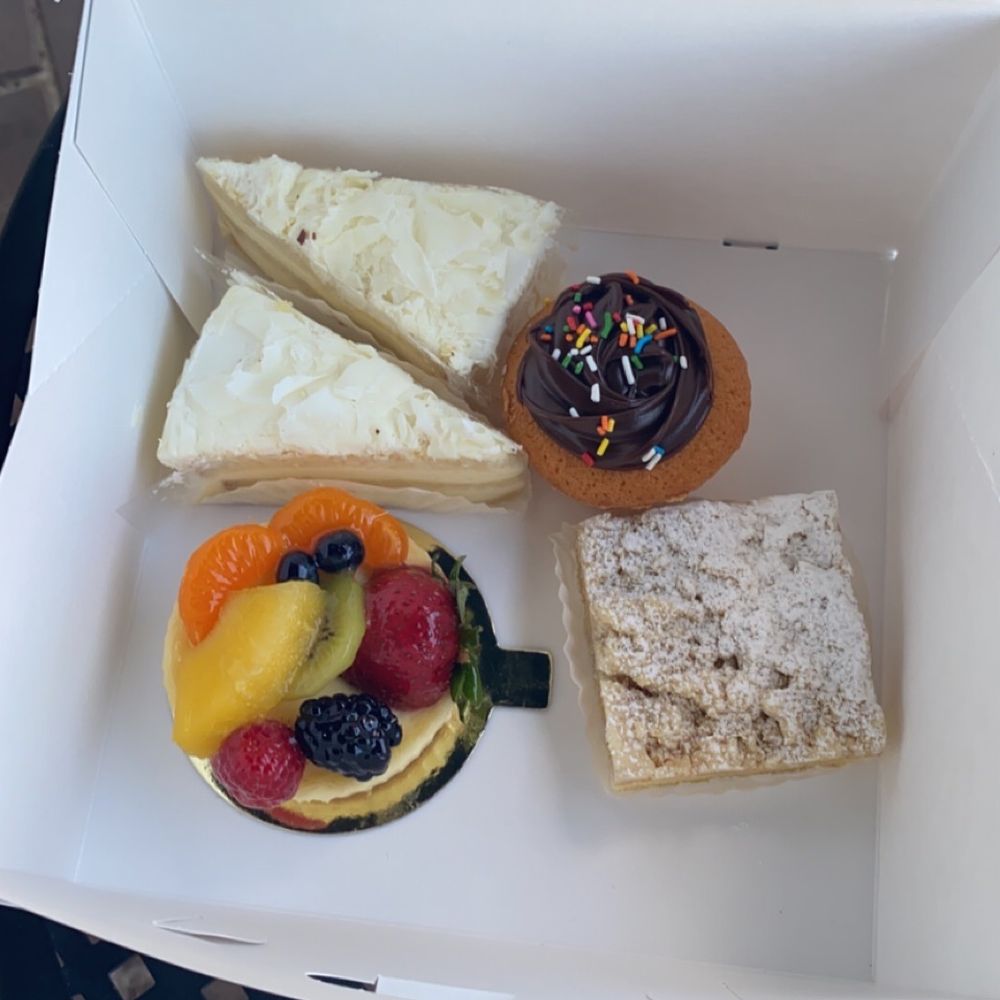 Pastries By Randolph - Assortment of goodies- crumb cake, chocolate cupcake, 2 white chocolate slices, and a fruit tart - Bakeries Near Me - Arlington, Virginia Pastries By Randolph - Assortment of goodies- crumb cake, chocolate cupcake, 2 white chocolate slices, and a fruit tart - Bakeries Near Me - Arlington, Virginia