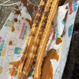Churros with very little dulce de leche and Nutella. Churros with very little dulce de leche and Nutella.