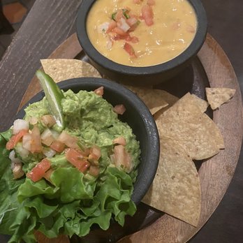 El Fenix - Fire roasted queso and guacamole. The fire roasted queso was just ballpark nacho cheese. No flavor at all. - Mexican Near Me - Dallas, Texas El Fenix - Fire roasted queso and guacamole. The fire roasted queso was just ballpark nacho cheese. No flavor at all. - Mexican Near Me - Dallas, Texas