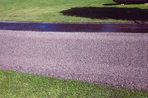 Tar & Chip or "Chip Sealing" - Ace Asphalt & Paving can install a high-quality, long lasting Tar & Chip driveway (also known as "Chip Sealing") for a fraction of the cost of regular asphalt or concrete. "Economical, Practical and Beautiful" best describes this terrific type of pavement. "Tar and Chip" or "Chip Seal" is a great alternative to regular asphalt or concrete, often costing less than HALF AS MUCH! Add to the value, appearance and functionality of your property by choosing this great paving method.