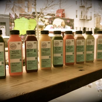 Juicery Kitchen - a row of juice bottles on a counter - Vegetarian Near Me - Brooklyn, New York