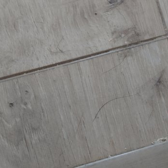 Stay Sharp Contracting - a pair of scissors on a wooden surface - Flooring Near Me Stay Sharp Contracting - a pair of scissors on a wooden surface - Flooring Near Me