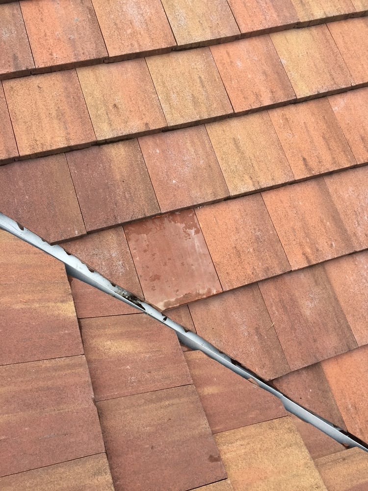 Slide of Schick Roofing