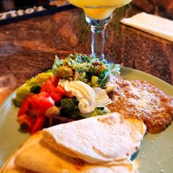 Mexican Amer El Tio - Quesadilla comes with side of refried beans, lettuce, tomato, guacamole, and sour cream