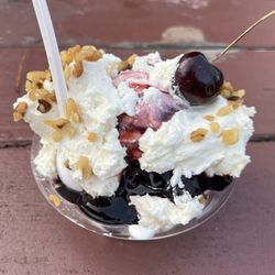 Smitty's Homemade Ice Cream - Frozen pudding ice cream with black cherry sauce and whipped cream, nuts, and a cherry