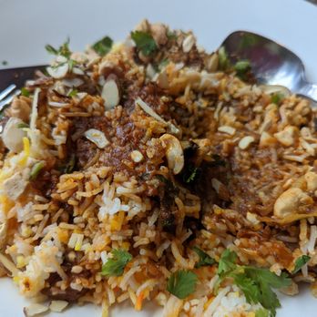 Caravan Kebab - Lamb Biryani: nah! Not really Biryani...rice and lamb were cooked separately and mixed together with dry fruits...really heavy. - Indian Near Me - Edmonds, Washington